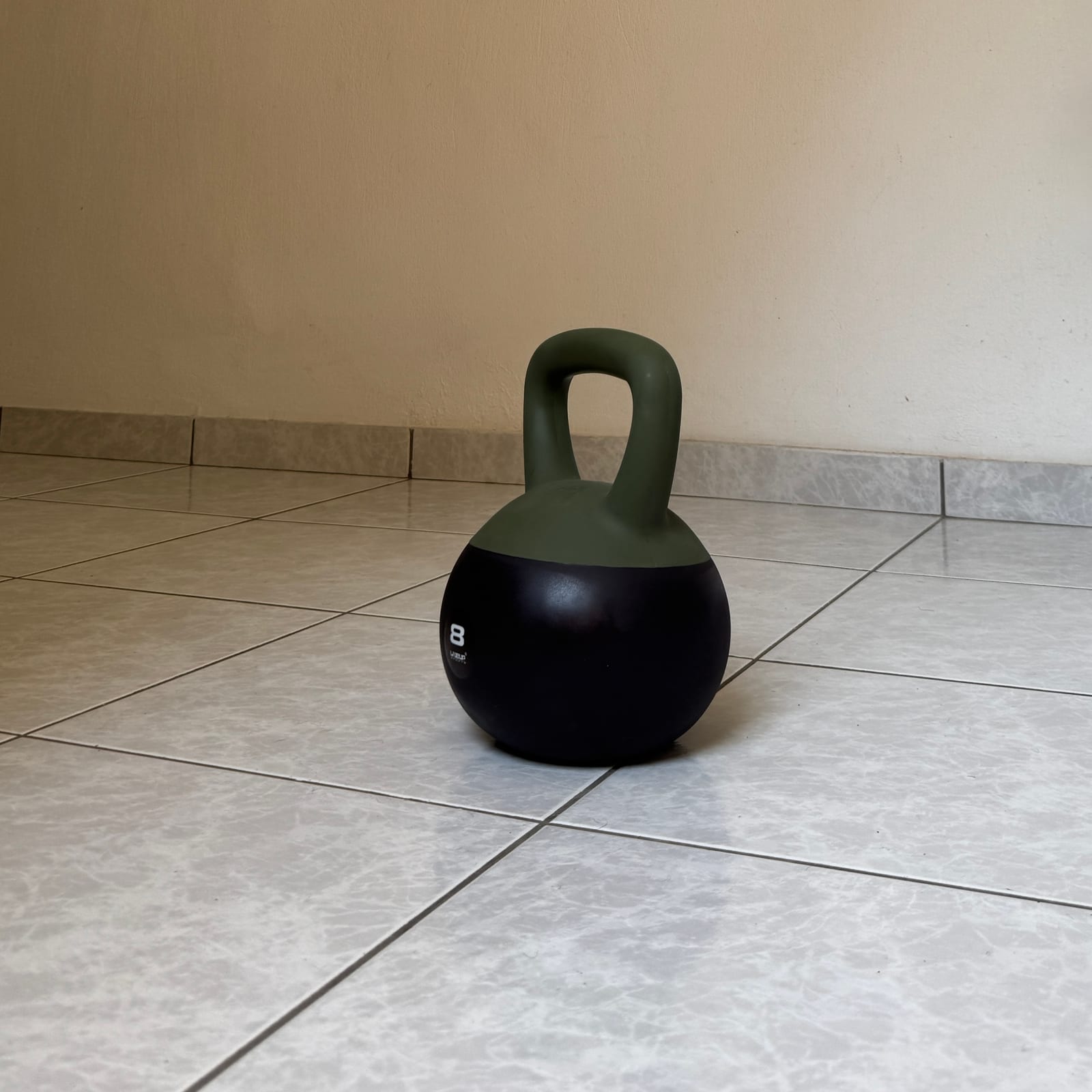 Kettlebell on the tiled floor of the private gym in Perama — personal training in Corfu (Kerkyra)